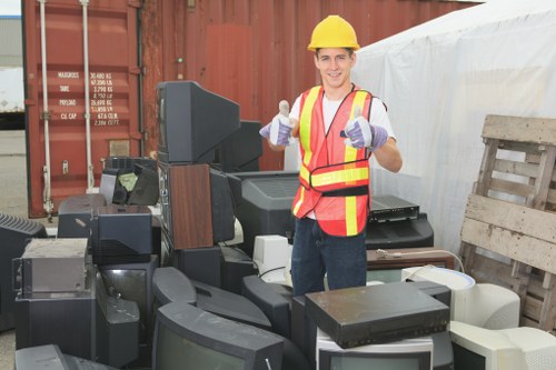 Front view of a commercial waste collection vehicle operating in Dulwich